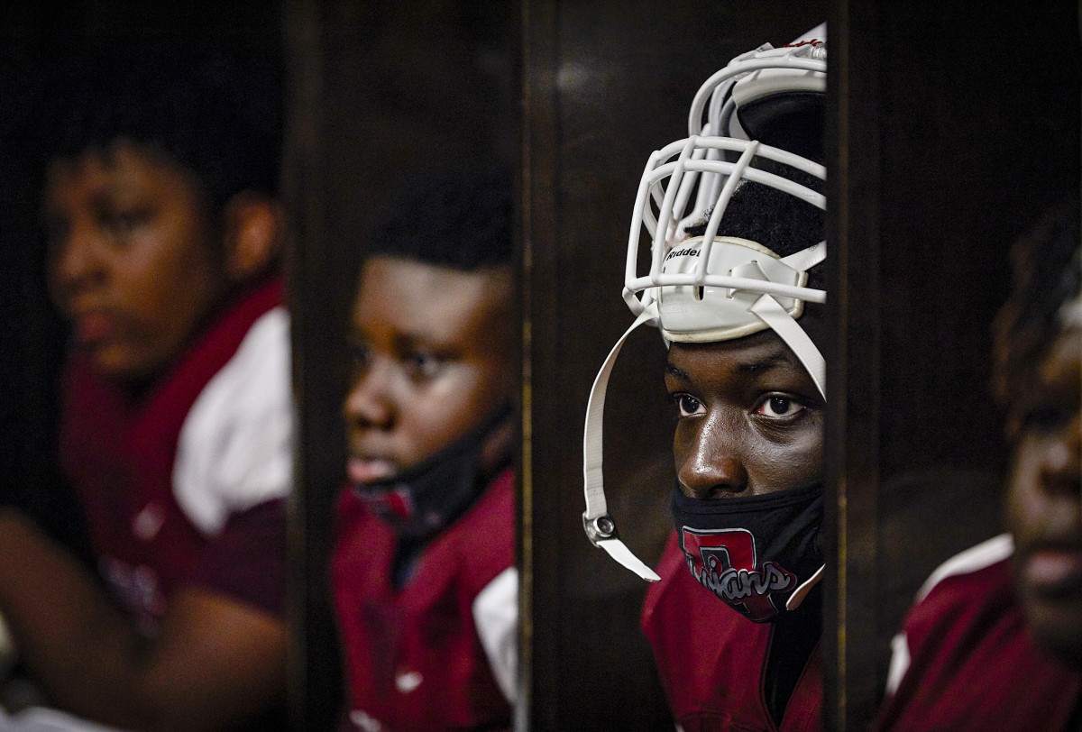 Ju-Marcus joined teammates and coaches in a risky moment of togetherness,  